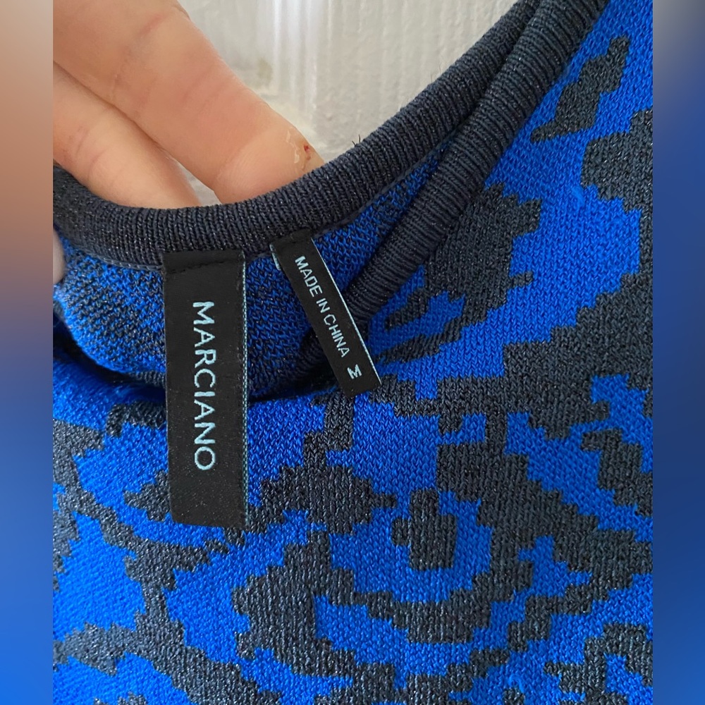 T This Mini Marciano dress has never been worn.